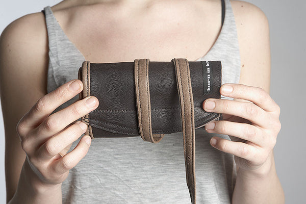 rolled up purse with straps